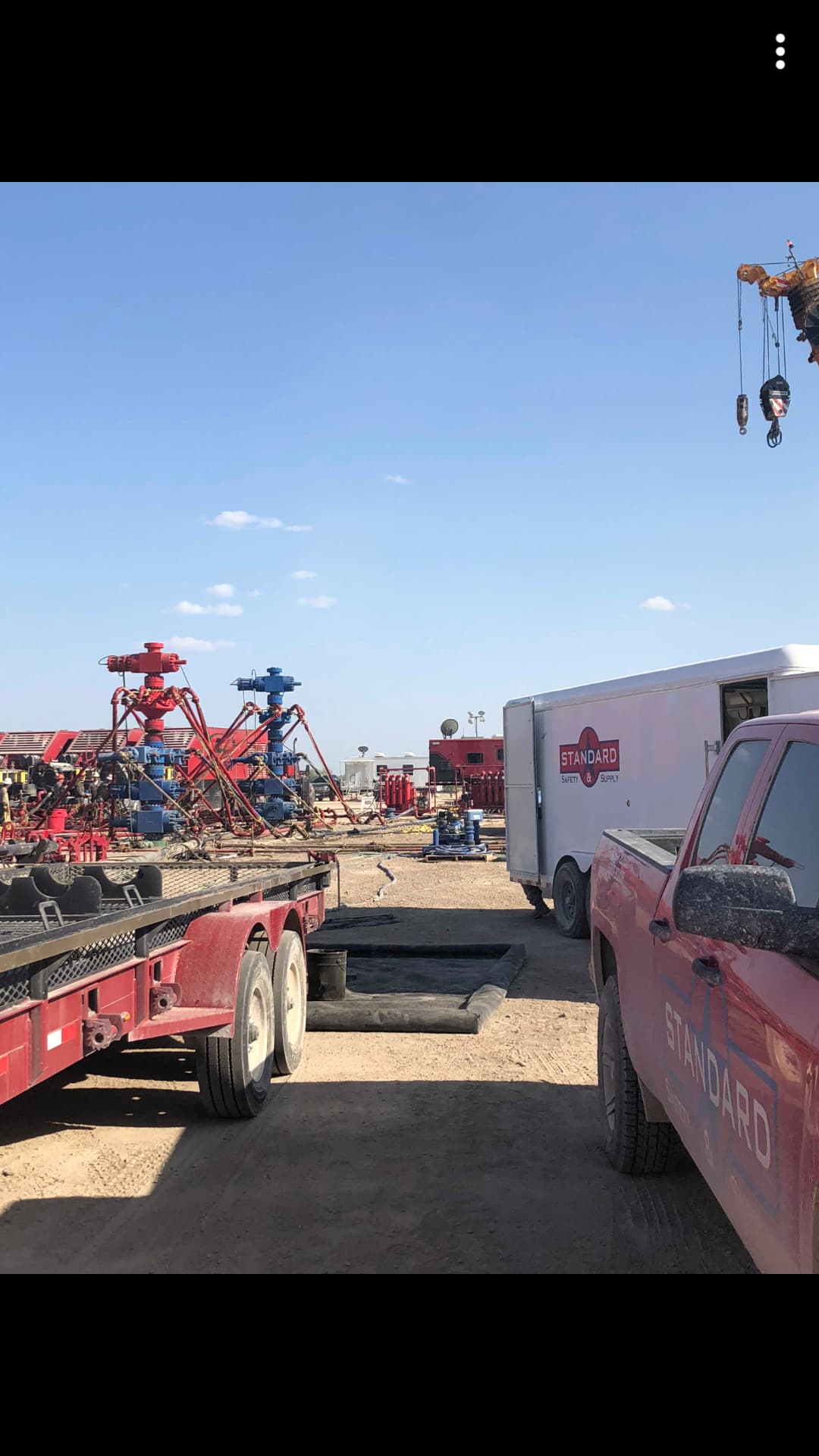 Standard Safety vehicles and equipment at a busy job site